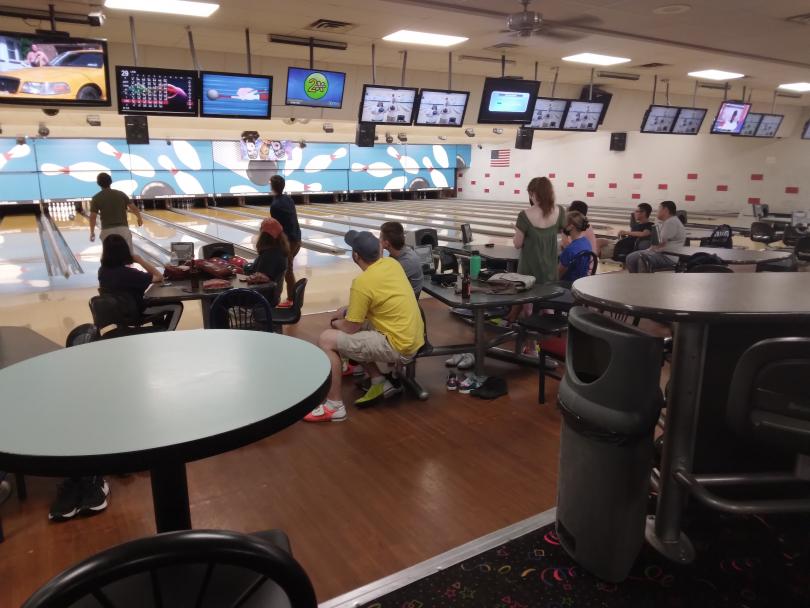 Statistics Graduate Student Association members bowl. 