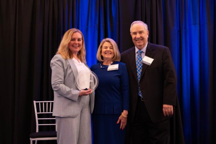 Dean Ana poses with an award winner