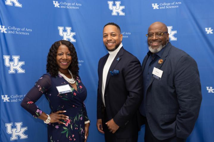 An award winner poses with their guests