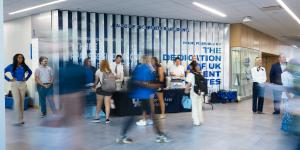 The Dean of the College of Arts and Sciences, Staff, and Administrators, hand out snacks and socialize with students on their first day of classes. 